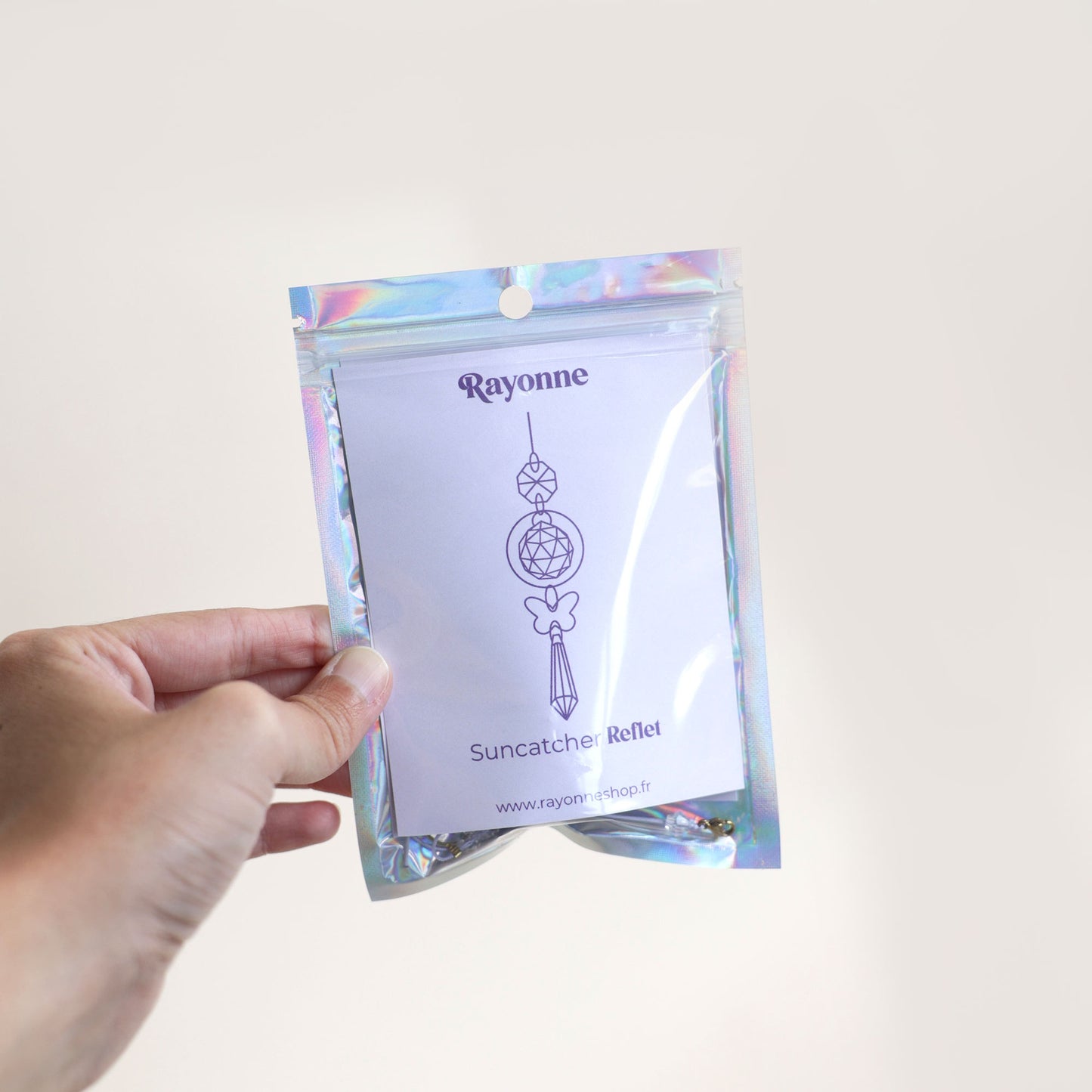 Packaging de l'attrape soleil Reflet fabriqué avec un papillon holographique par la marque Rayonne®