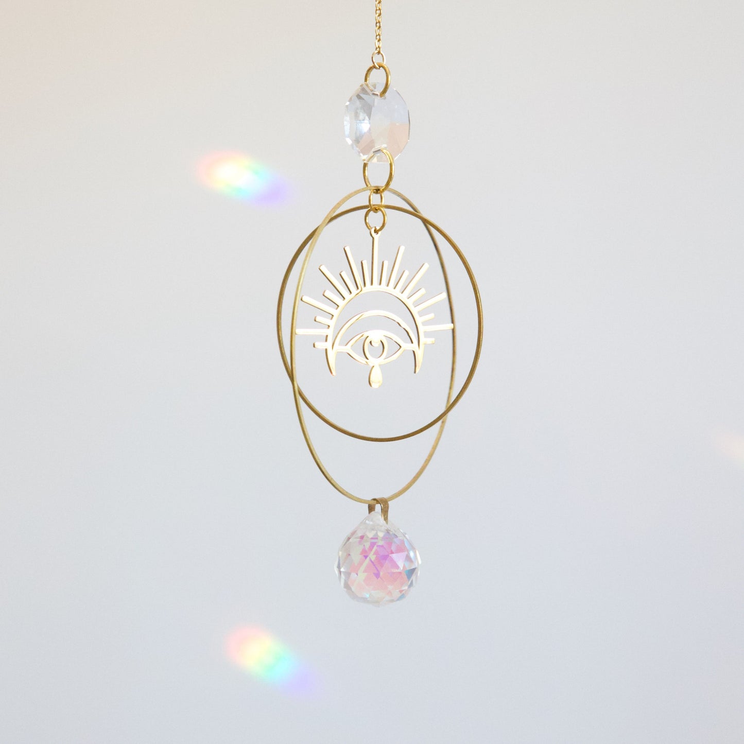 suncatcher en cristal et oeil en laiton