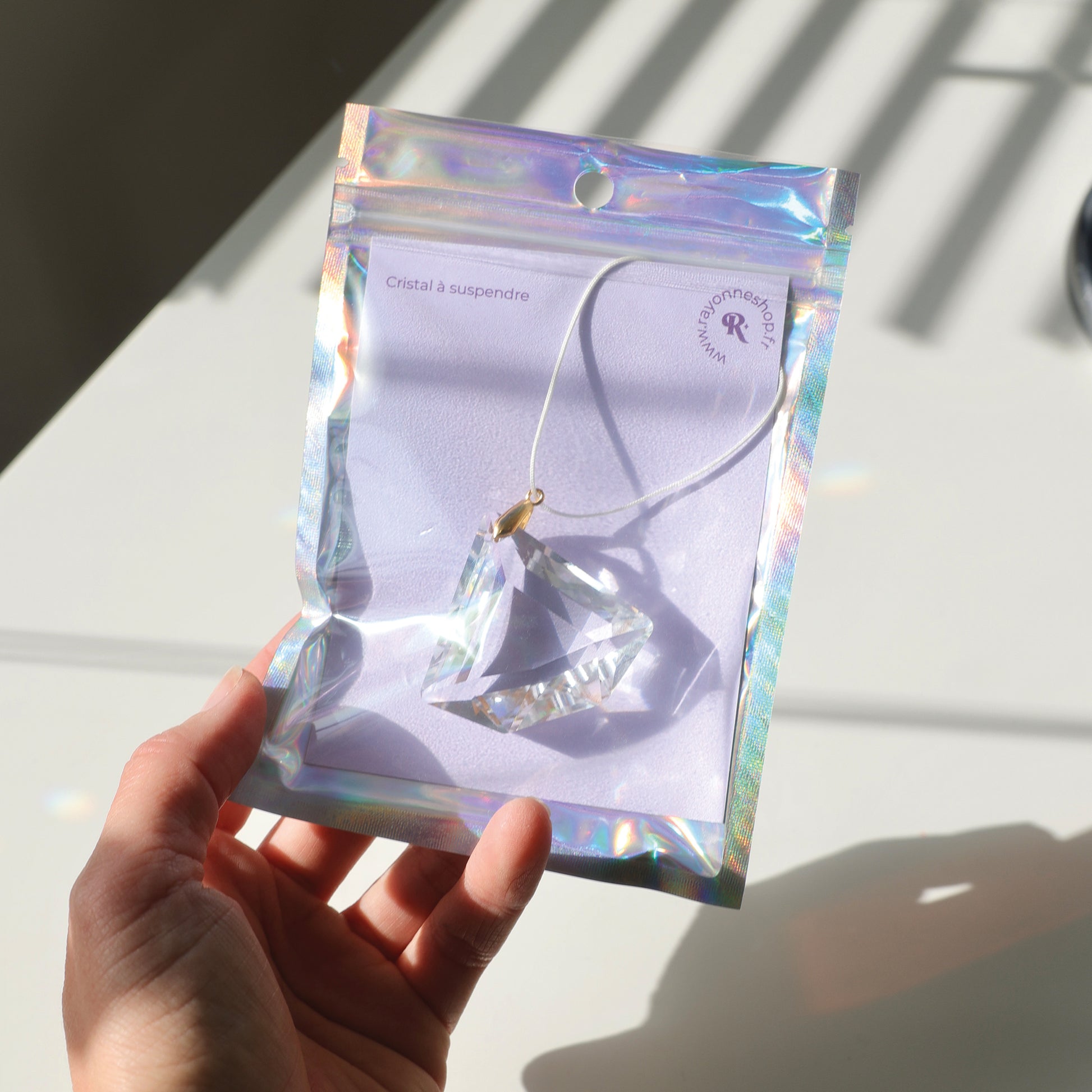 Attrape-Soleil ASTRA de Rayonne emballé dans son packaging holographique